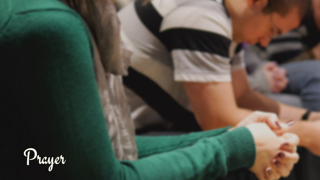 We engage in prayer during worship assembly at the Oak Grove Church of Christ.